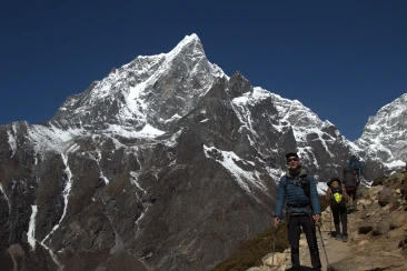 Client posing with mountain