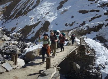 crossing narrow wooden bridge