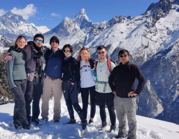 trekkers posing in front of Ama Dablam