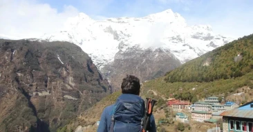 trekker enjoying namche village view